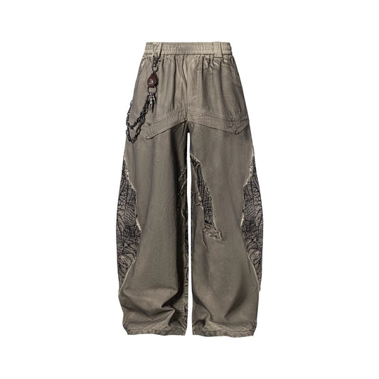 2025New American High Street Irregular Ripped Patchwork Niche Design Casual Scimitar Pants for Men and Women